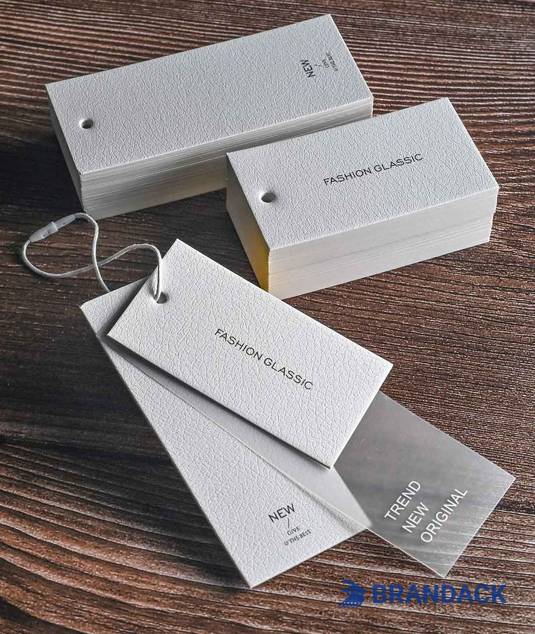 Custom Apparel Hang Price Tags | Bespoke Apparel Swing Tags with Logo Custom Apparel Hang Price Tags | Bespoke Apparel Swing Tags with Logo