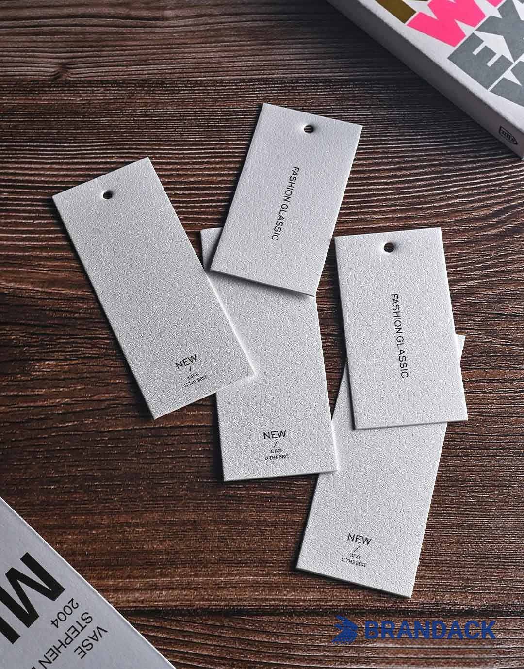 Custom Apparel Hang Price Tags | Bespoke Apparel Swing Tags with Logo Custom Apparel Hang Price Tags | Bespoke Apparel Swing Tags with Logo