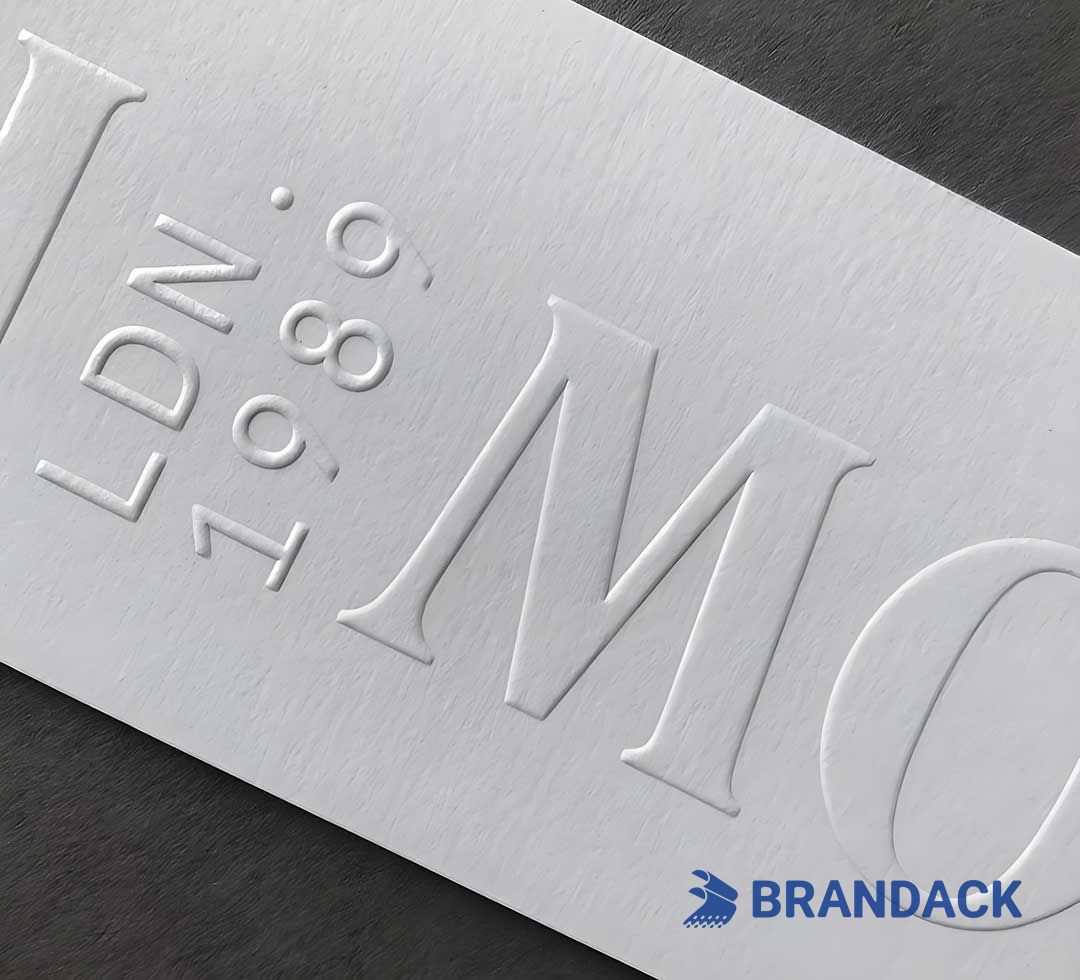 What are the commonly used packaging surface treatment processes?